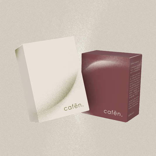 Cafēn product packaging on a neutral background